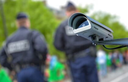 Security camera with police in background
